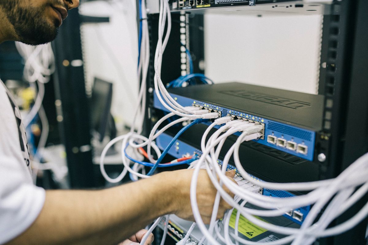 AlphaStone engineer working on network infrastructure